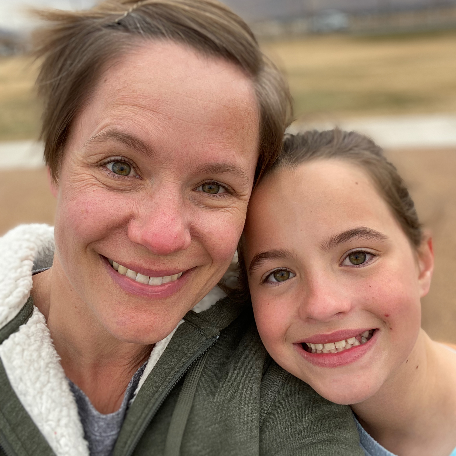 mom and daughter smiling