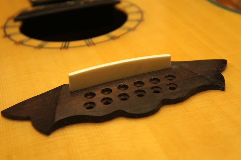 Handmade bone saddles for acoustic guitars Jack's Instrument Services
