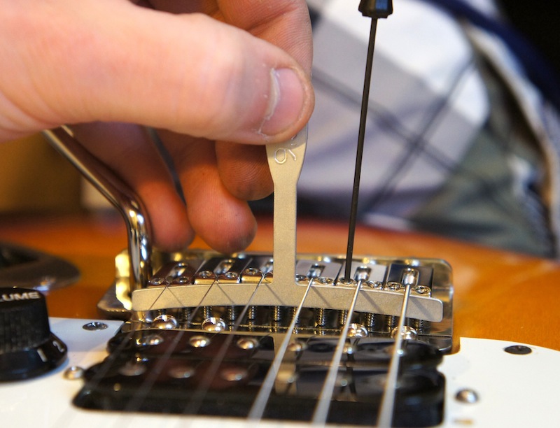 How do I know what to adjust to properly lower the action? Truss rod