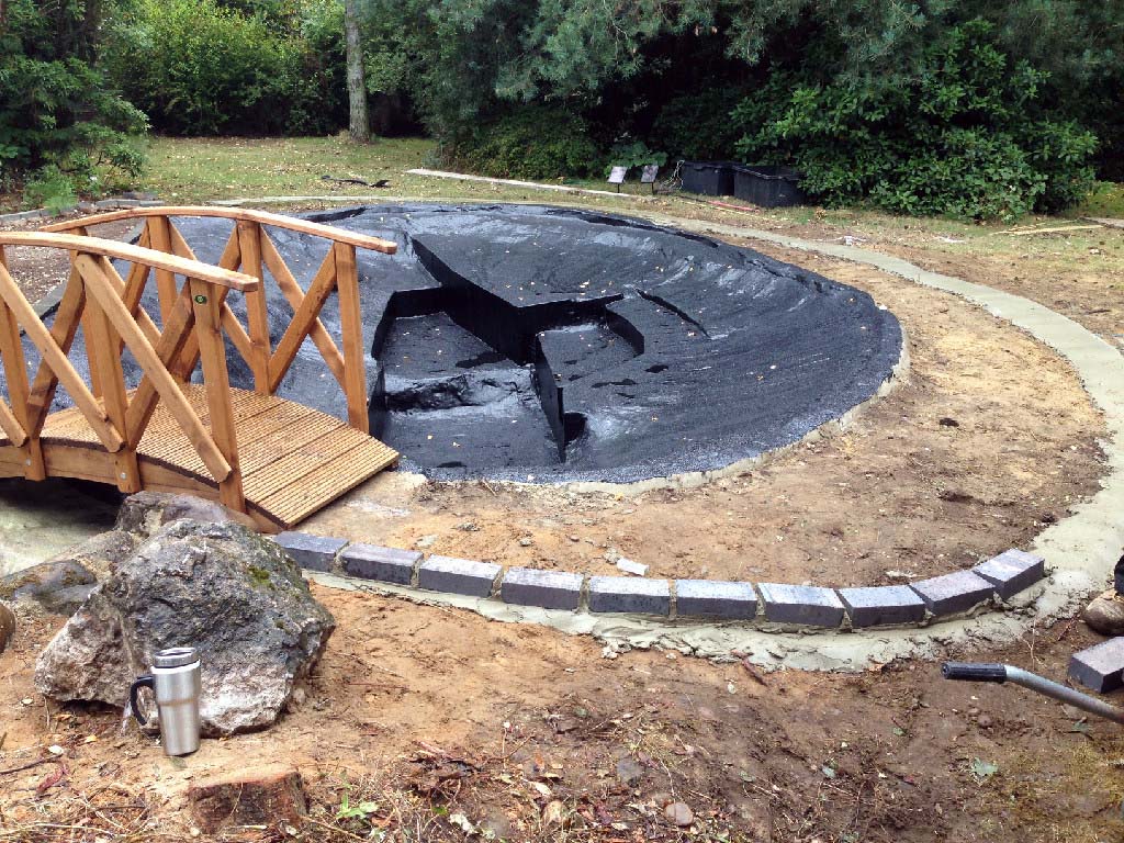 Fibreglass pond with waterfall, path and bridge Calverton JDM Pond
