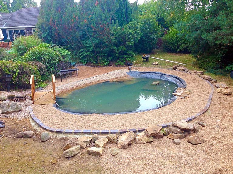 Fibreglass pond with waterfall, path and bridge Calverton JDM Pond