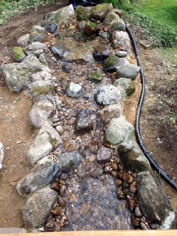 Fibreglass pond with waterfall, path and bridge Calverton JDM Pond