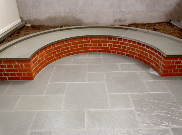 Backyard Feature Blue Stone Patio & Curved Bench Jeff King & Company