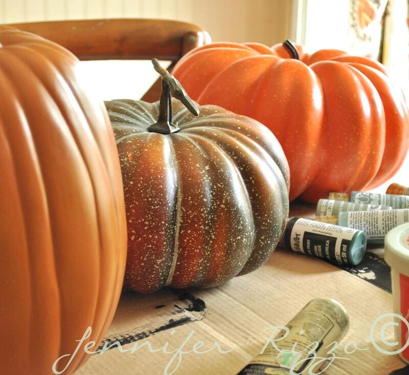 Painting fake pumpkins to look more realistic.... Jennifer Rizzo