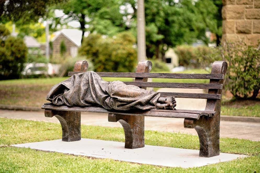 Homeless Jesus placed at the entrance to Newman College Jesuits Australia
