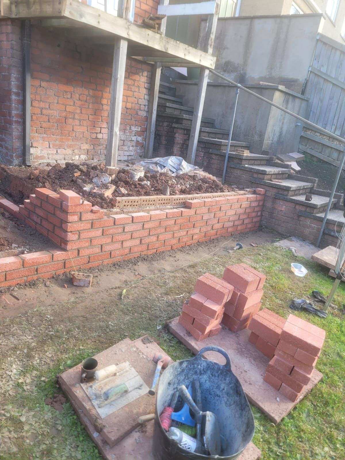 New red brick retaining wall supplied and build in Newport J Jones
