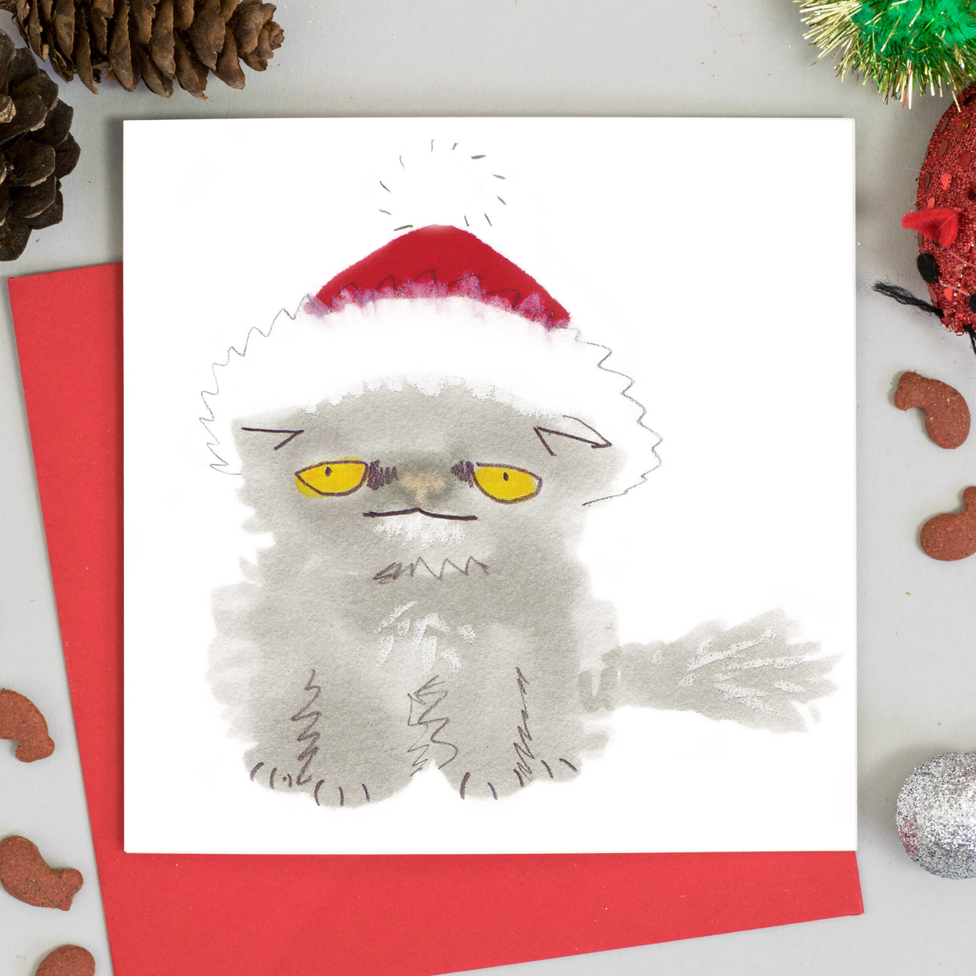 grey persian cat in a santa hat christmas card