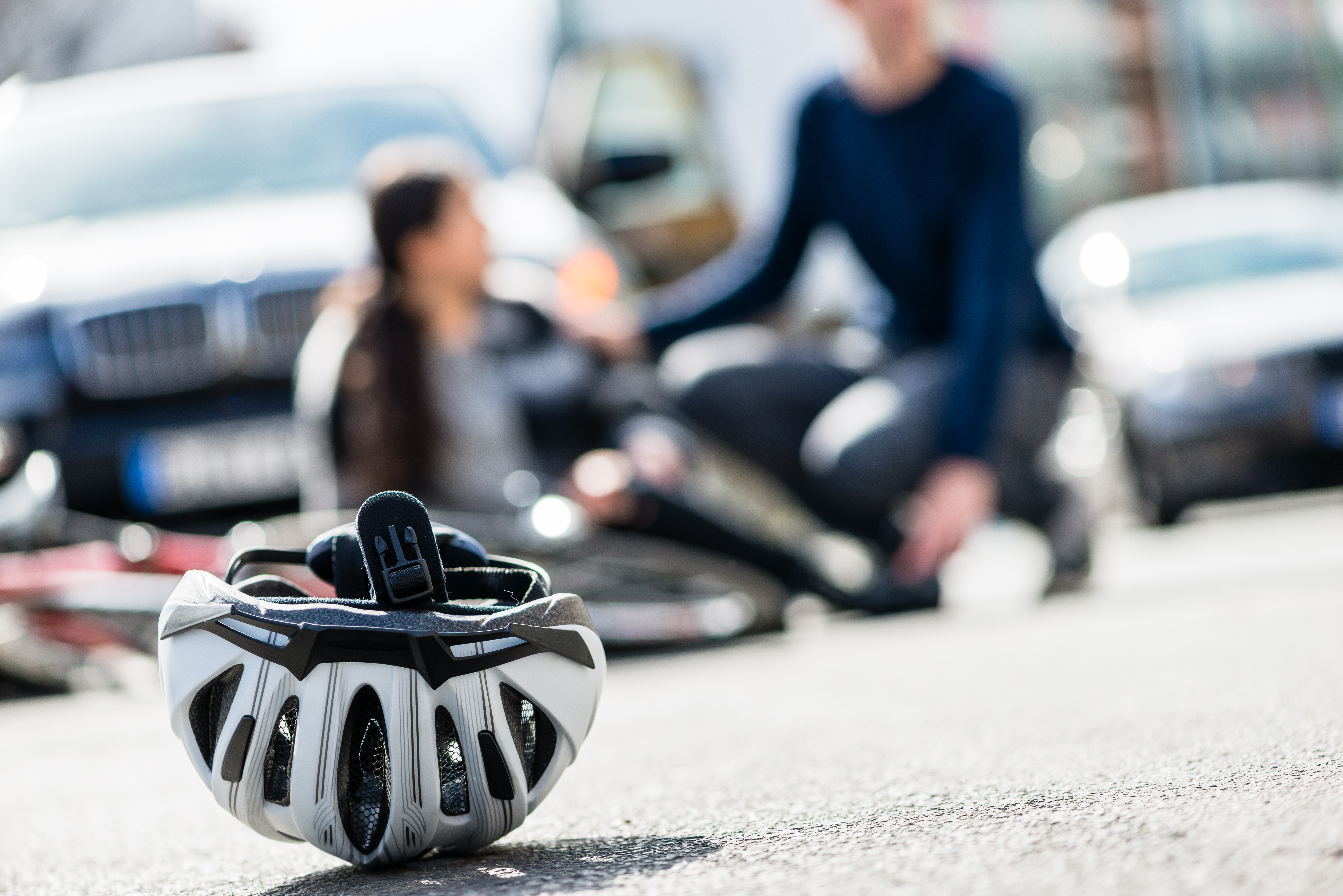 Closeup of a bicycling helmet fallen down on the ground after a Joe