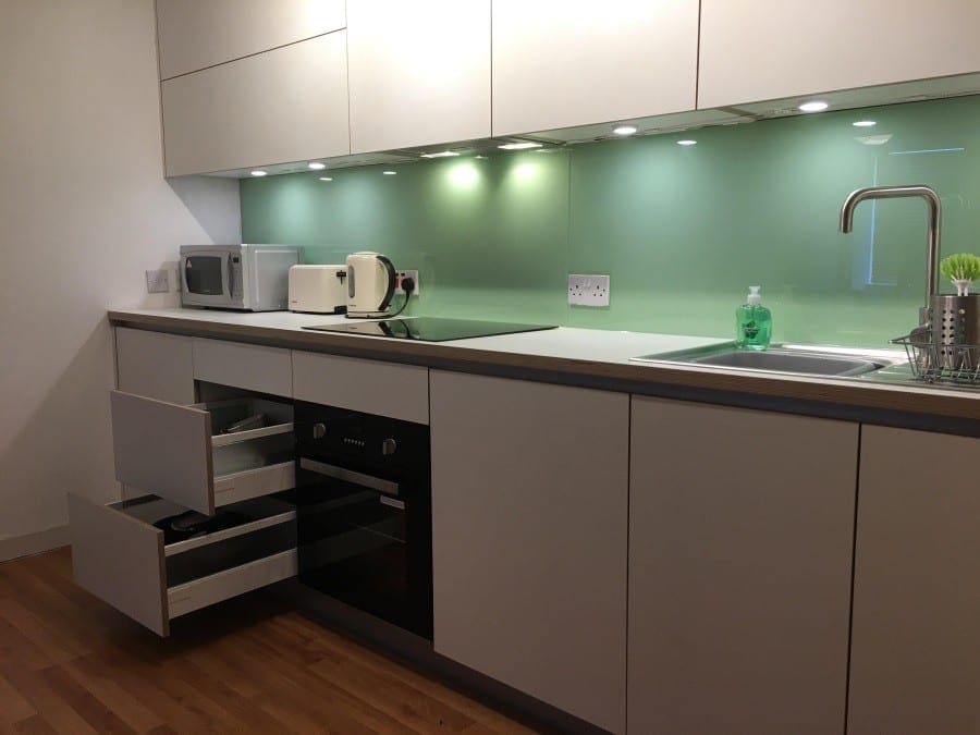 White handleless mat modern style plywood core kitchen. Sheffield