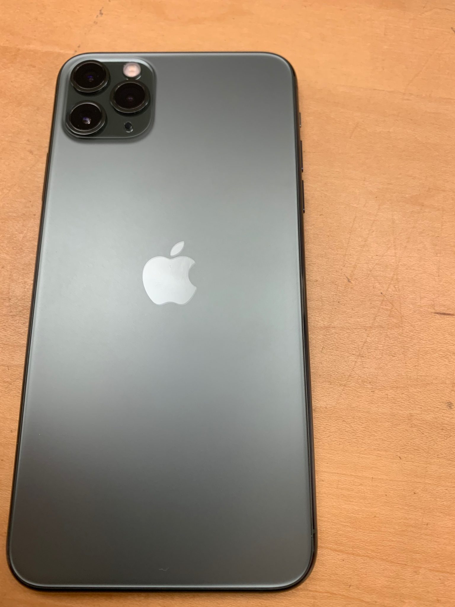 iPhone 11 Pro Max midnight green on table