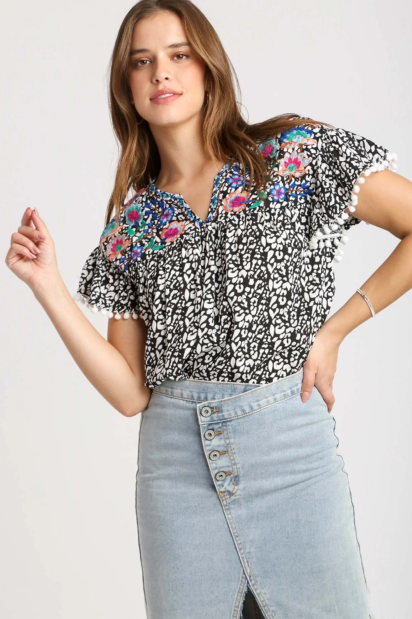 Umgee Animal Print Top with Flower Embroidery and Pom Pom Fringe Detai