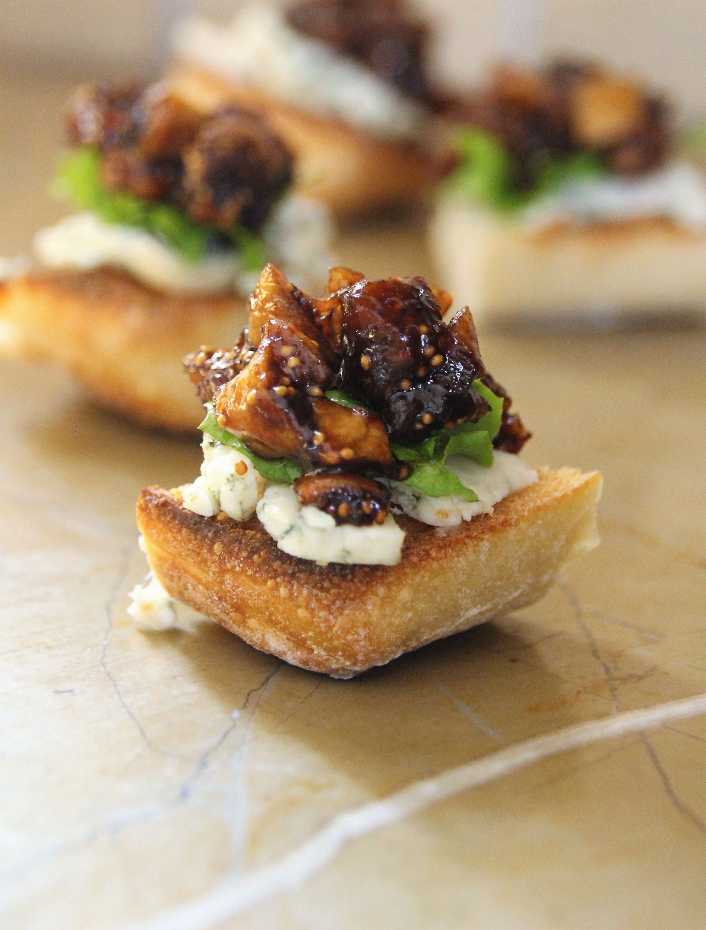 Balsamic Glazed Dried Fig And Blue Cheese Crostini Just Crumbs By