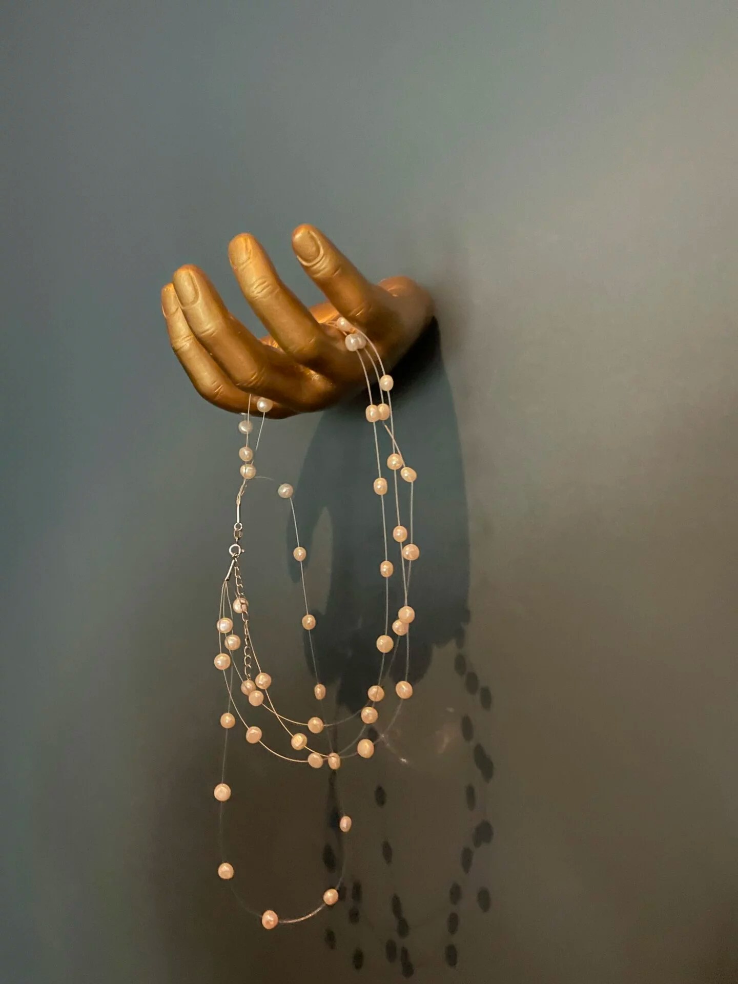 Gold Wall Hand Juxtapose Decor