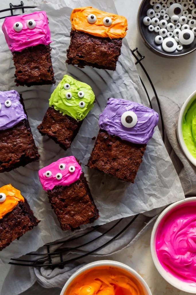 monster cake brownies on a cooling rack with colored icing