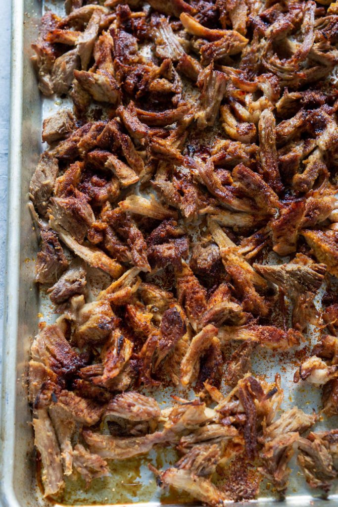 pork carnitas on a baking sheet