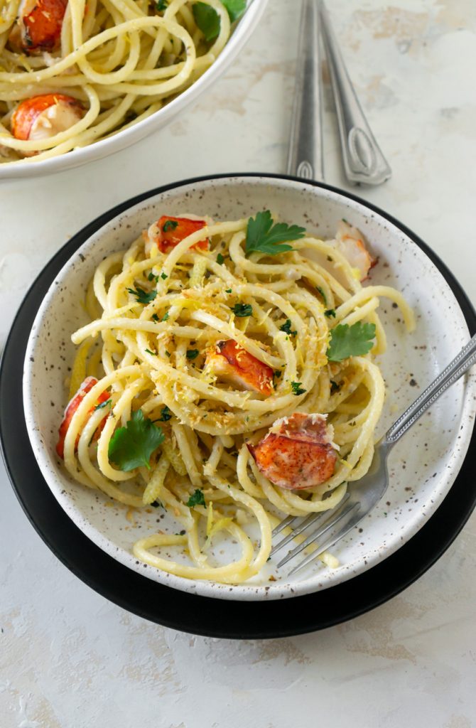 pasta in a white bowl with a silver fork