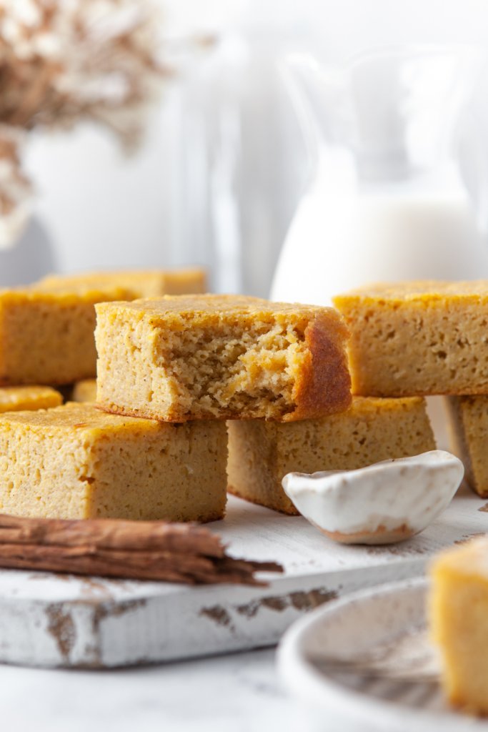 cornbread squares, one with a bite taken