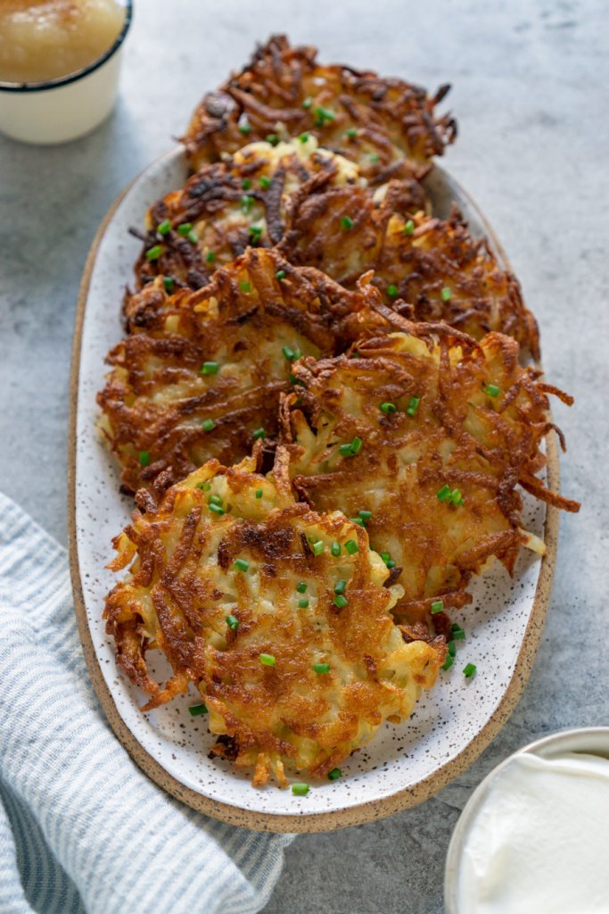 potato latkes on an oval serving plate