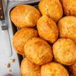 air fryer biscuits on a tray with raspberries on the side