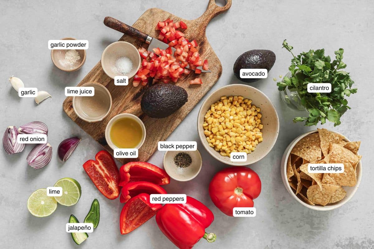 A flat lay of labeled ingredients for corn salsa