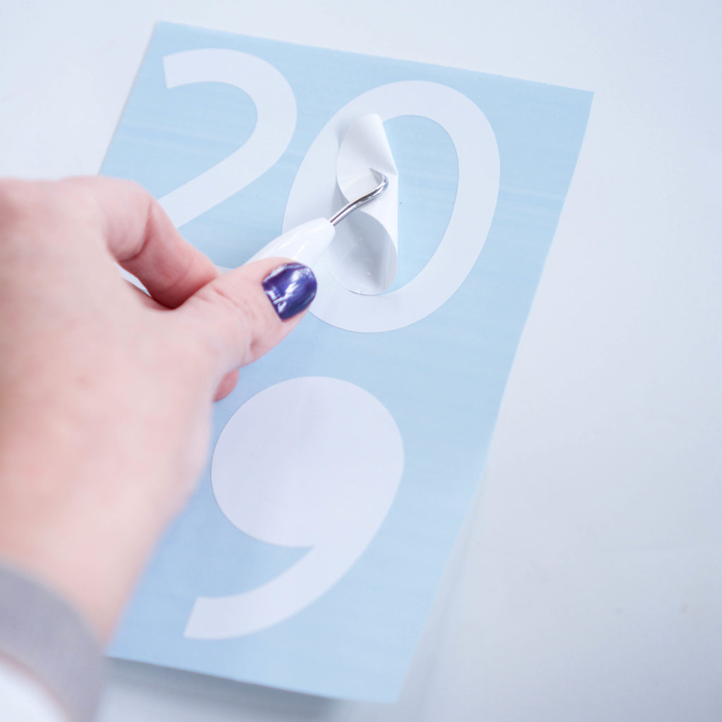 How To Apply Adhesive Vinyl To Balloons For An Easy New Years Party