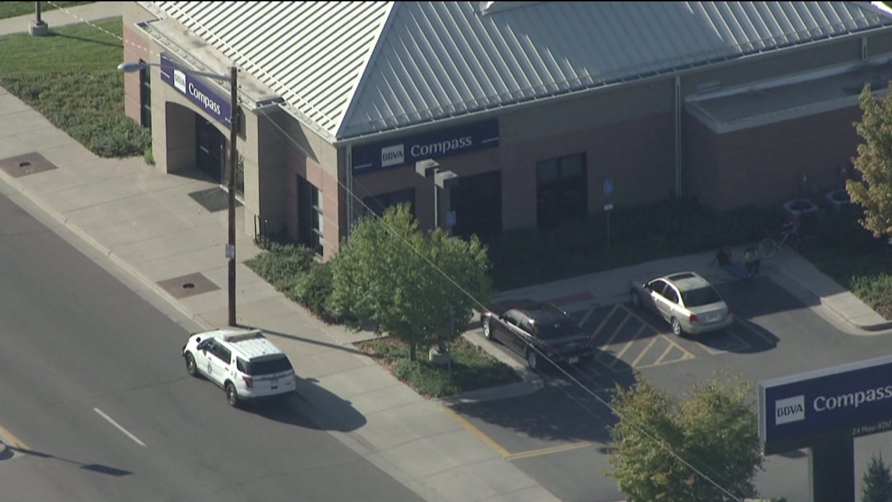 Denver police launch search for 2 suspects after bank robbery on Colfax