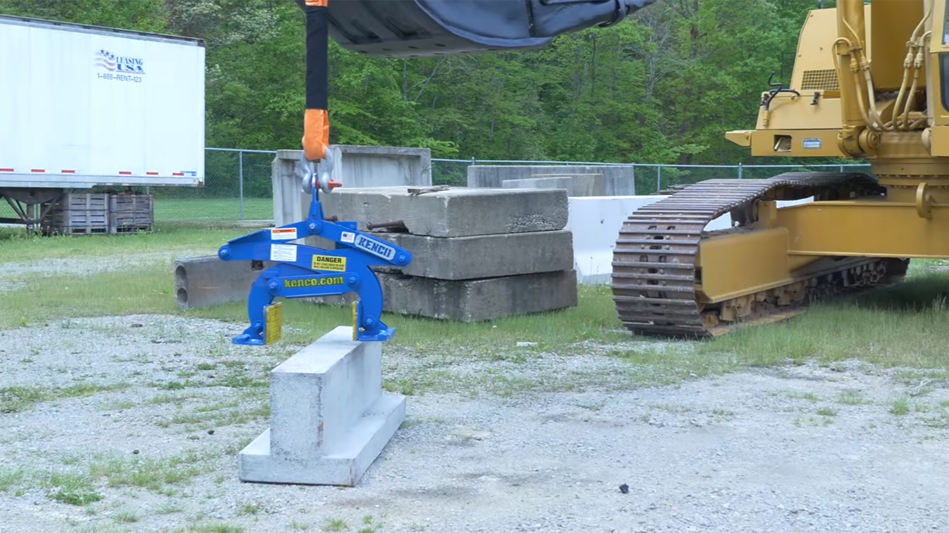 Monument Lifter photos showing this attachment at work on the job site