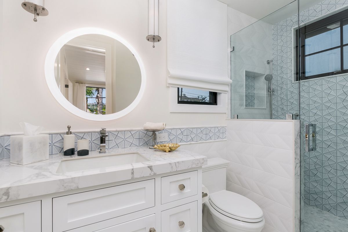 22 Simple & Clean White Bathroom Design Ideas [The Spruce]