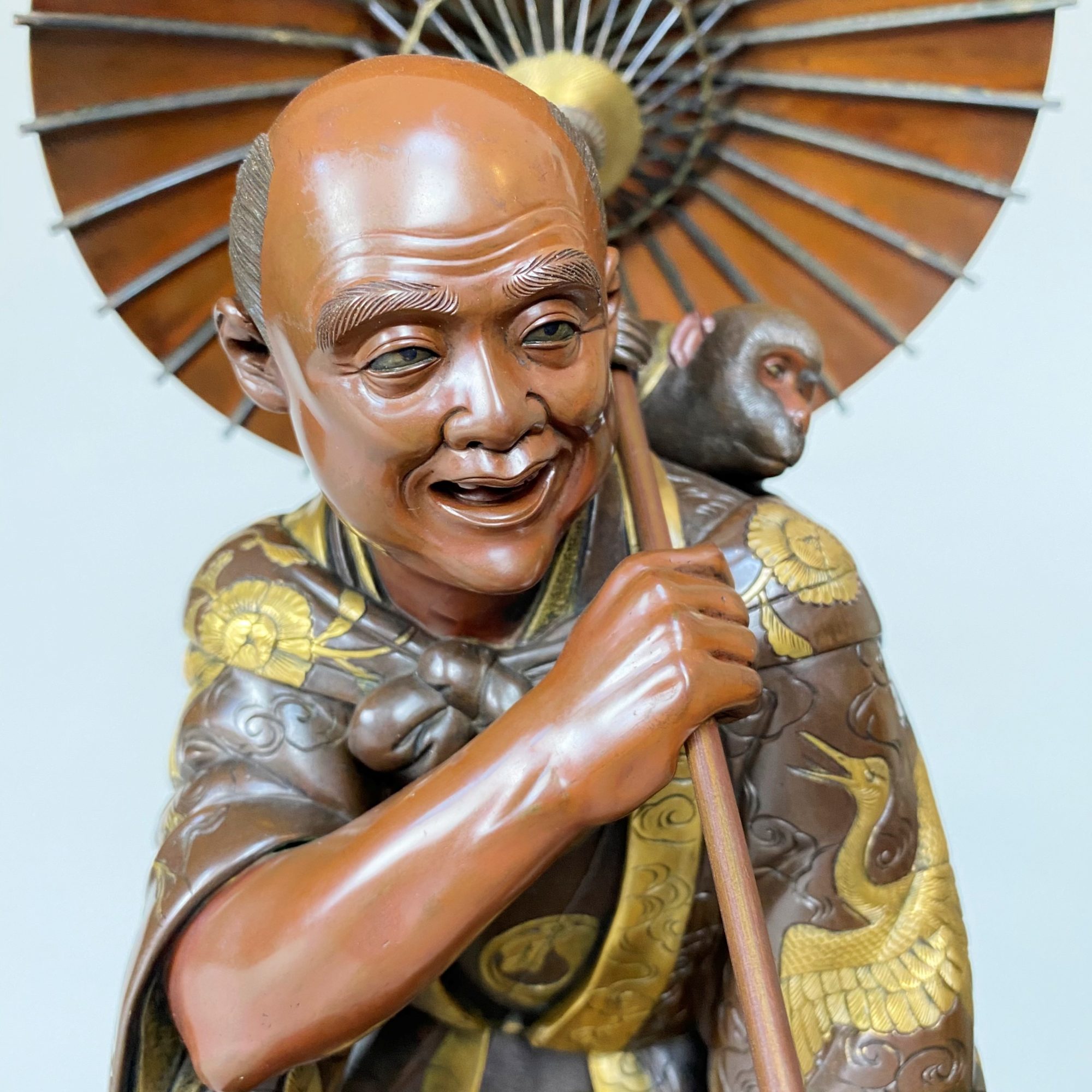 A large Japanese 19th Century Bronze Okimono of a monkey trainer (Miyao