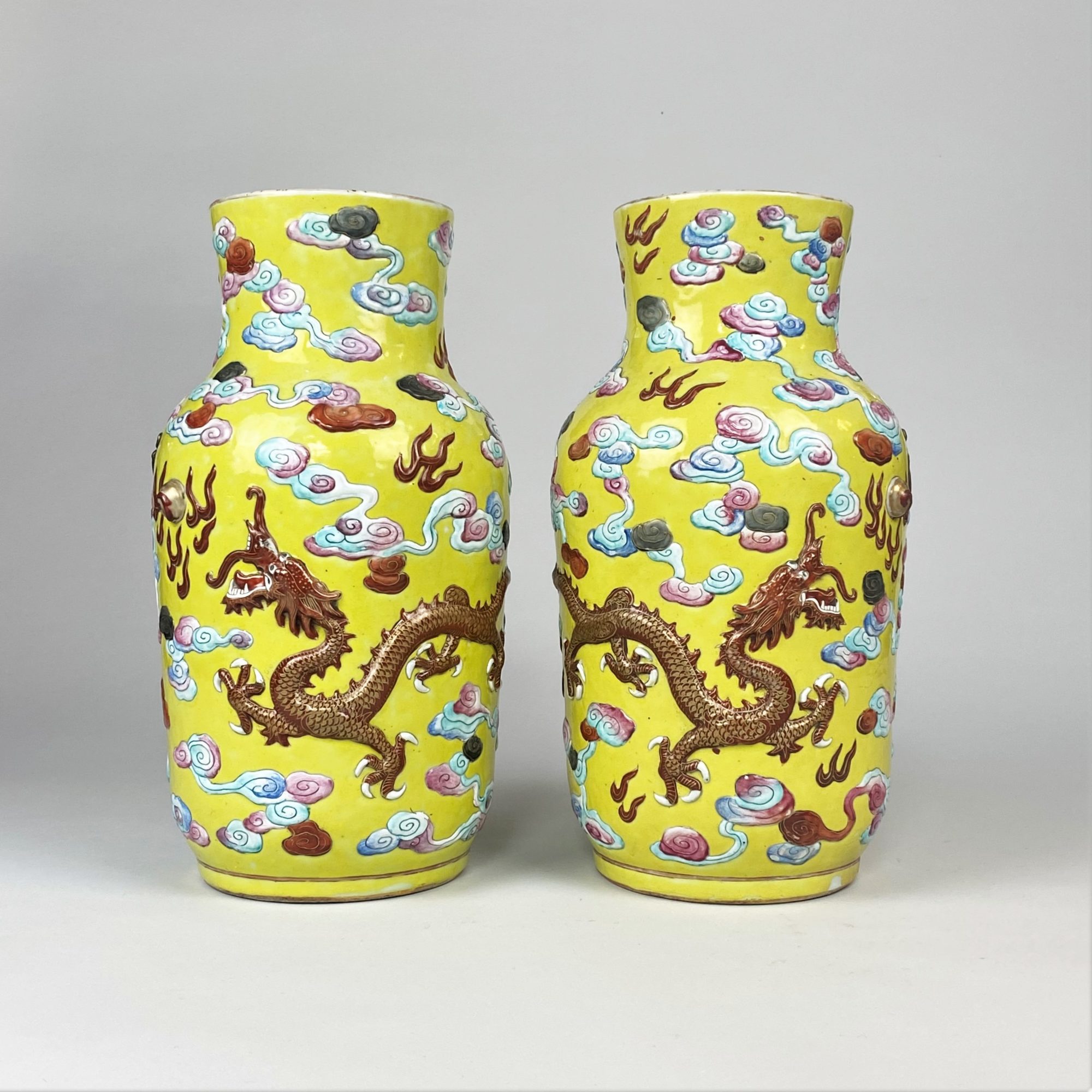 A dramatic pair of antique Chinese yellow ground Dragon vases Kevin