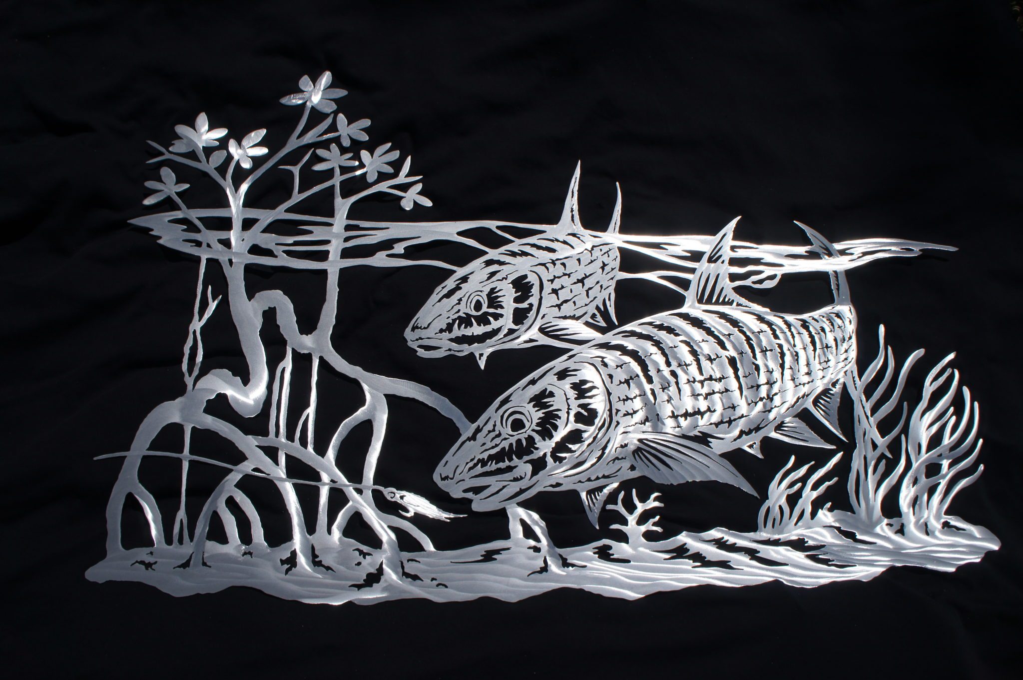 ‘Drawing with fire’ Caleb Goins creates pierced metal art Florida