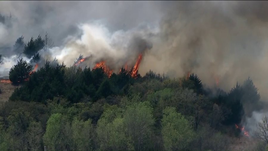 Cedar trees, strong winds fueling fire in Logan County; residents Cedar trees, strong winds fueling fire in Logan County; residents