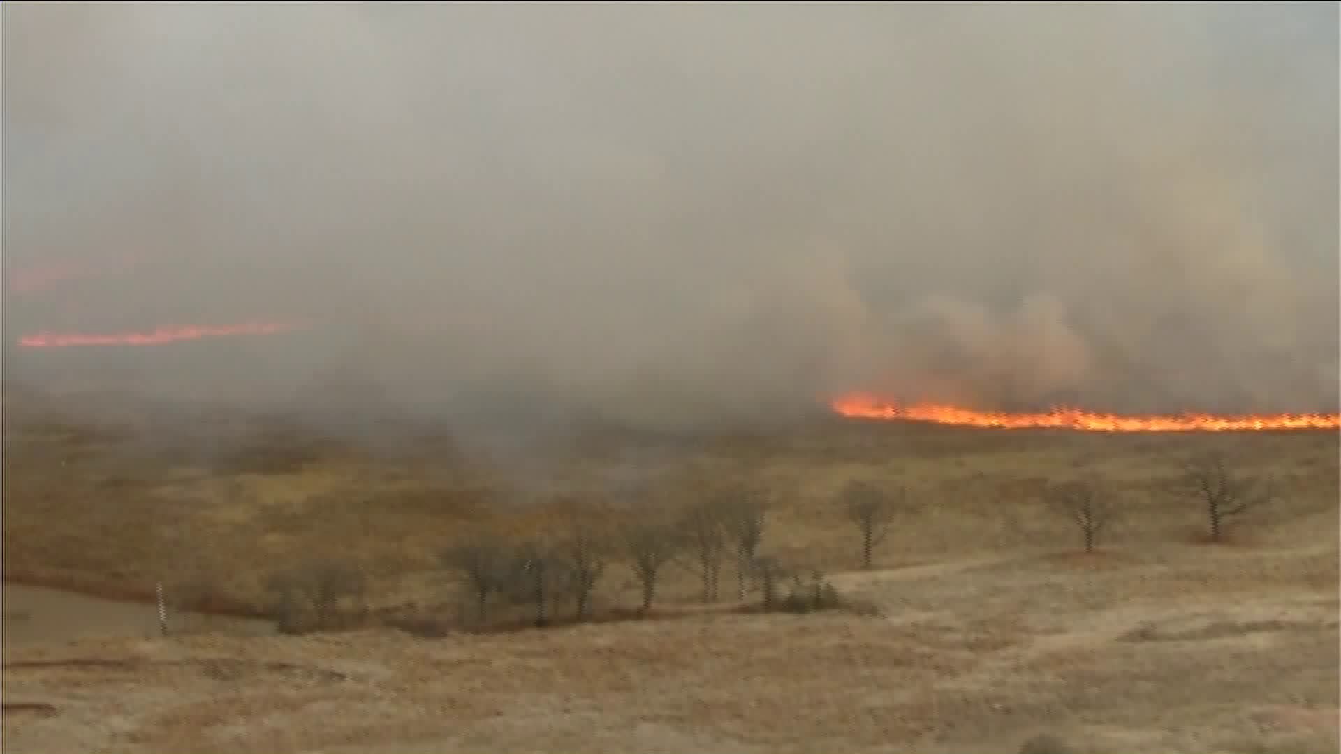 Firefighters battling large grass fire near Mulhall Oklahoma