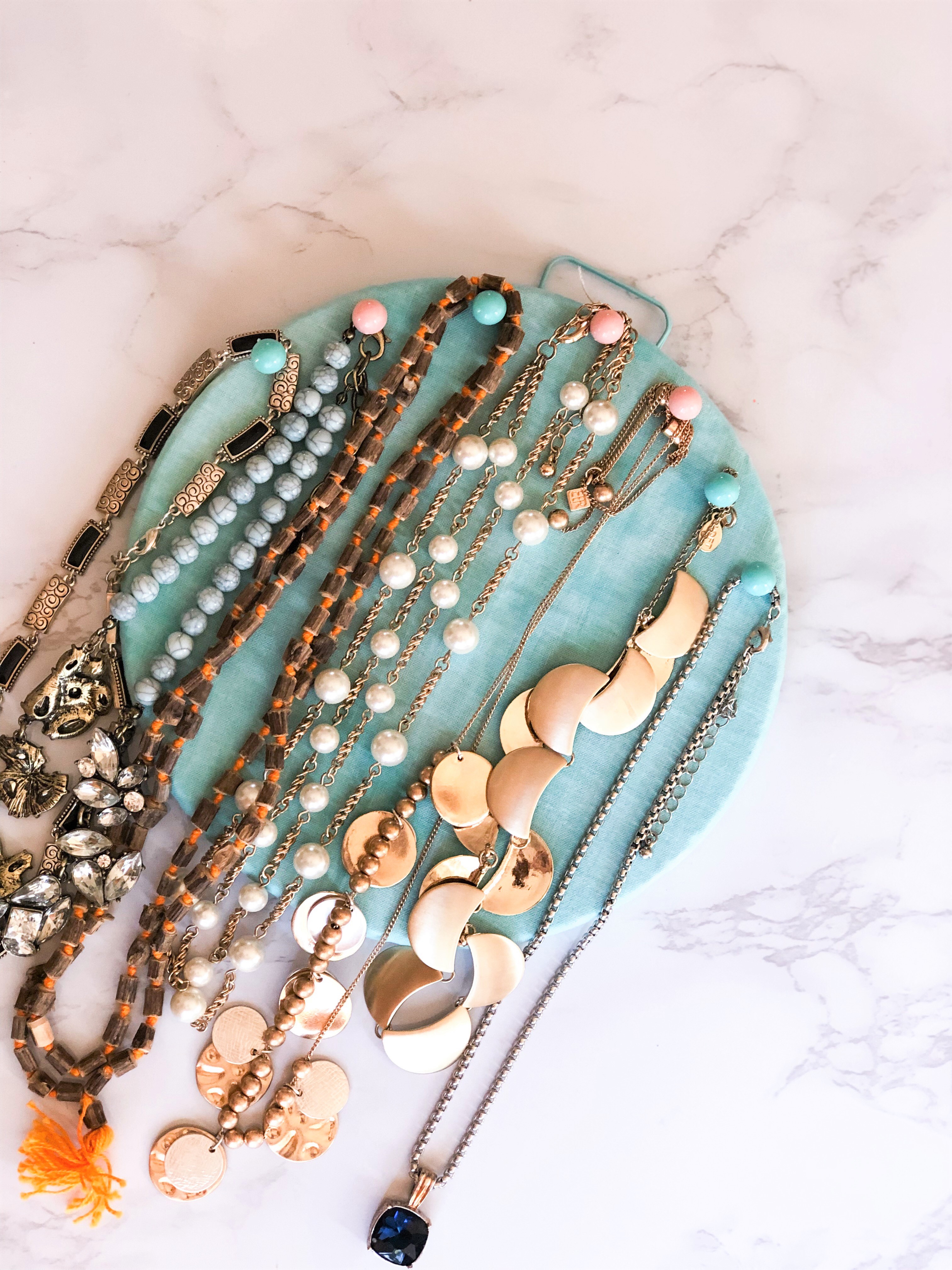 DIY Necklace Organizer_made with cork board, scrap fabric, hot glue gun and some thumb tacks