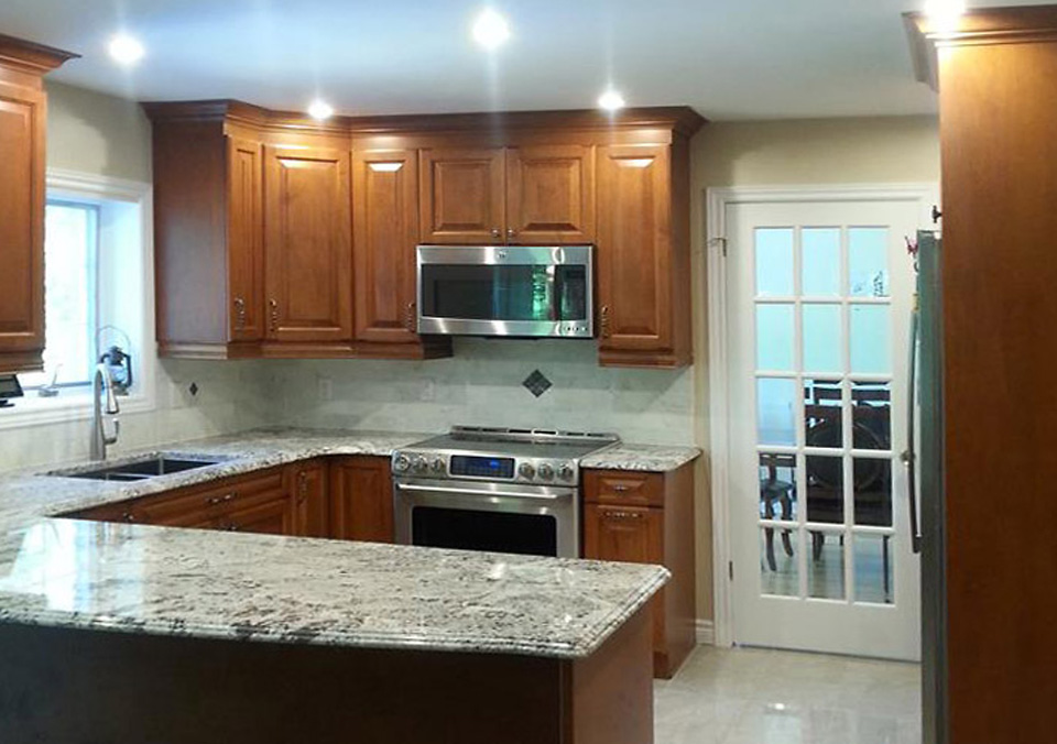 Maple Kitchen With White Granite Countertops Kitchen