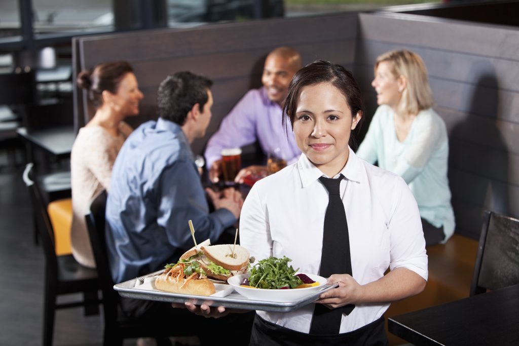 Waitress carrying tray with food Klinedinst PC