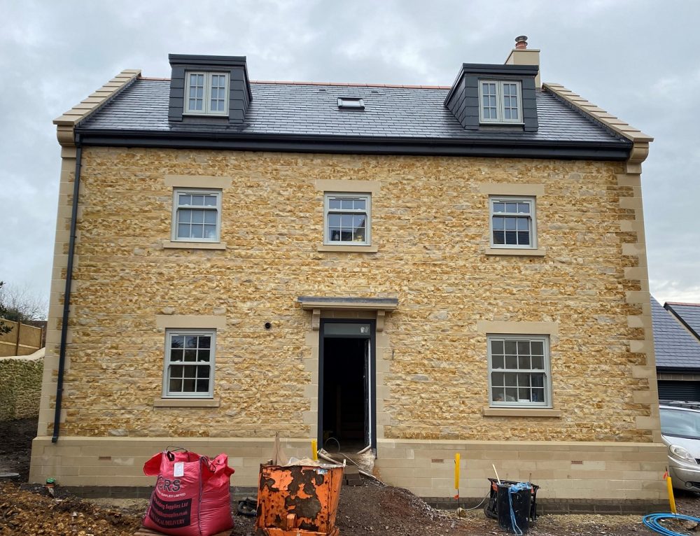 Cast bath stone faced blocks, lintels + cills for end terrace extension
