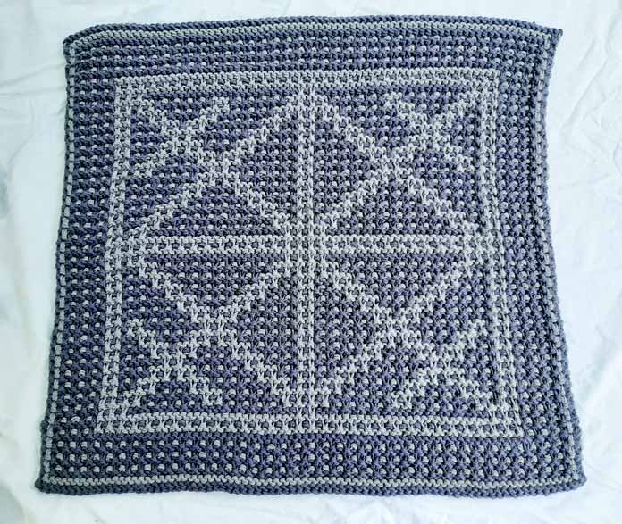 Mosaic knitting Using two colors of yarn to knit a comfy situpon