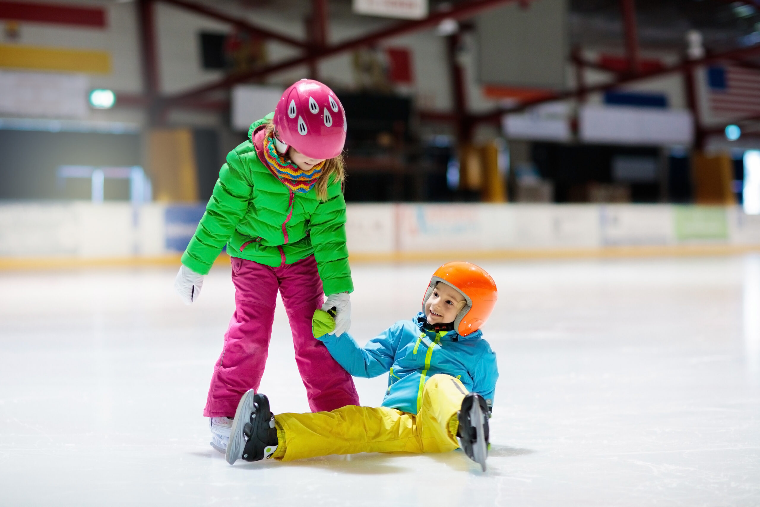 Child skating on indoor ice rink. Kids skate. Korcsolya oktatás