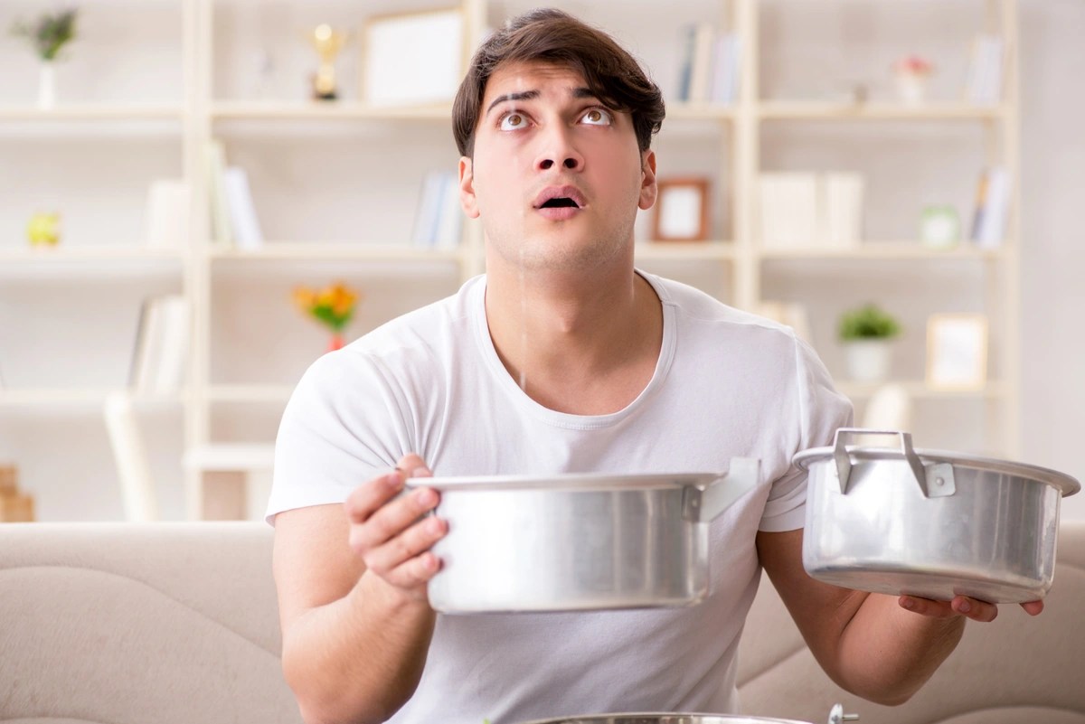 What Water Leaking From Your Ceiling Means & What To Do