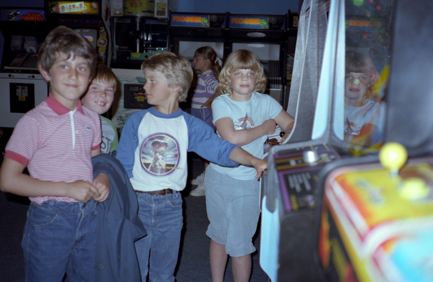 A collection of photos of 80s video arcades