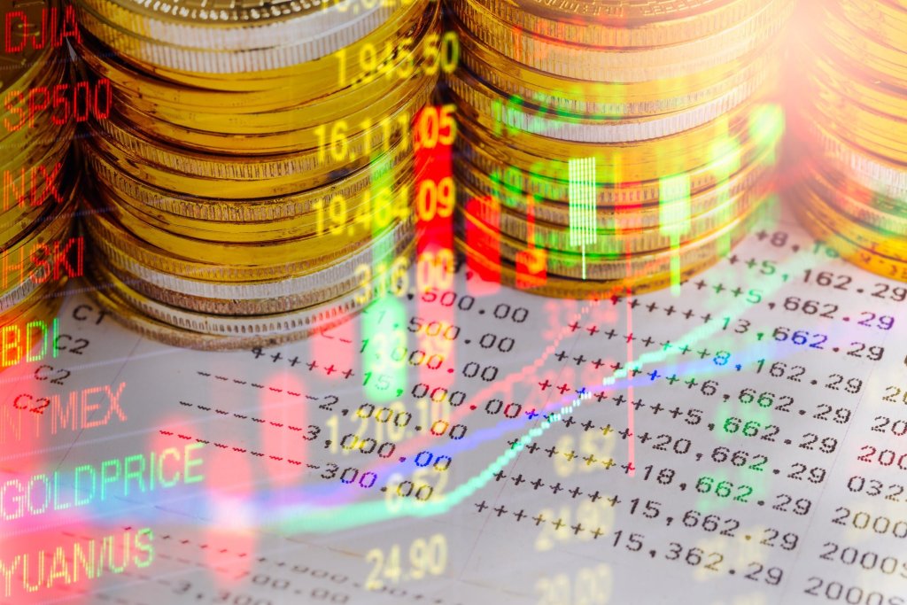 stacks-of-gold-coins-on-financial-charts.jpg