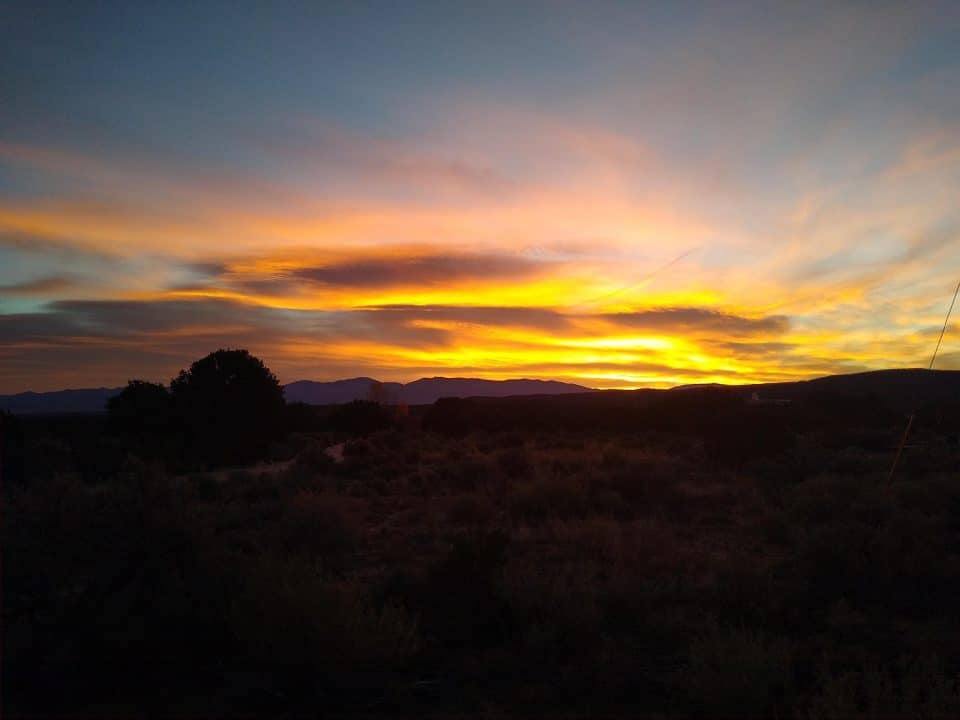 Daily Postcard Golden Sunrise Over Pajarito Acres