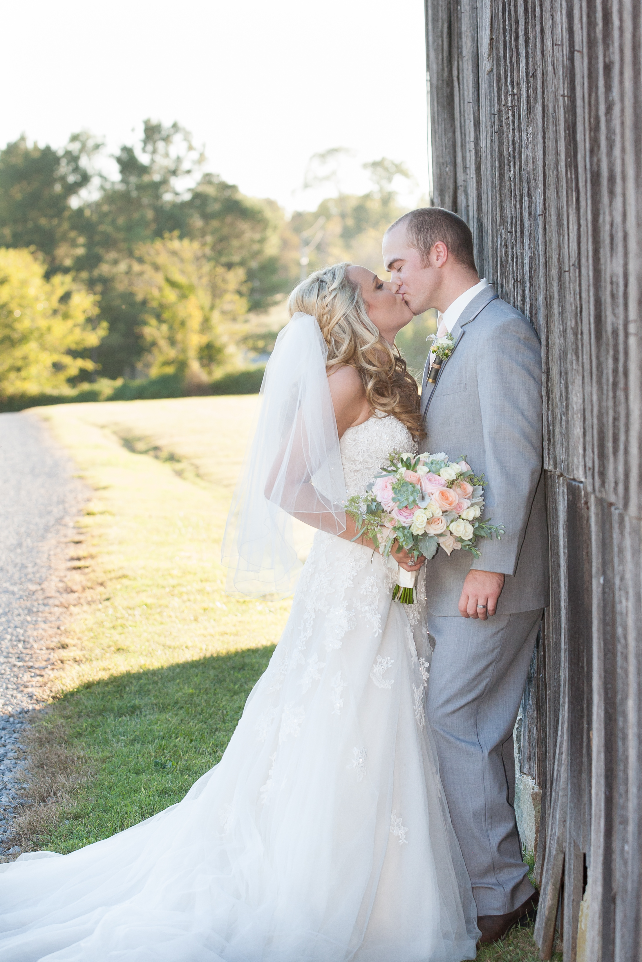 farm wedding kiss at barn Nashville Venue
