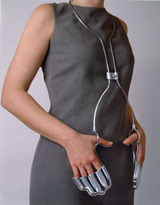 Wearable Sculptures that Make the Wearer Perform a Gesture