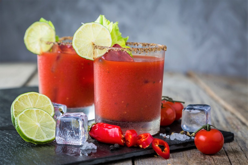 A pair of Bloody Marys with fruit and vegetable fixings The Leaf