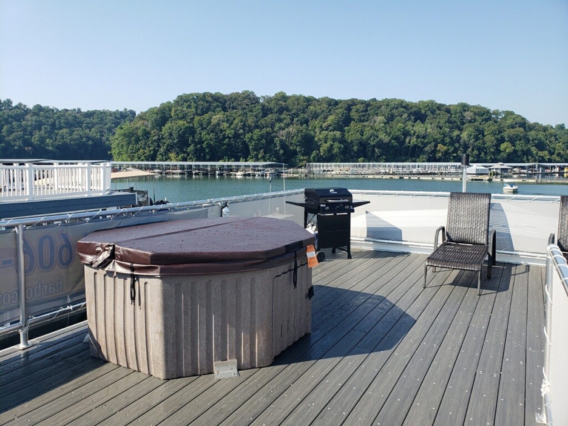 The silver tiny houseboat Lees Ford Marina