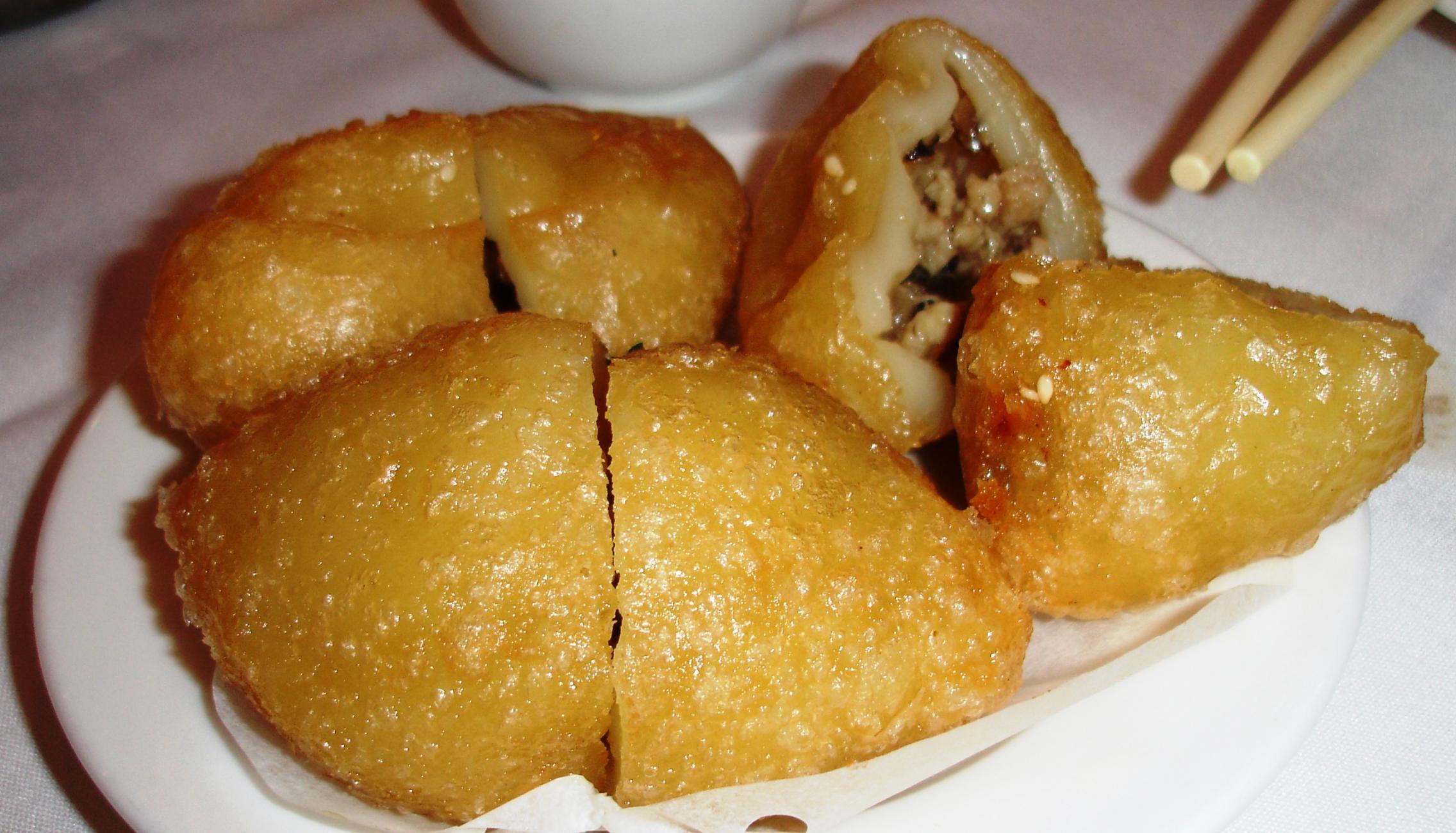 Fried glutinous rice dumplings have a stickychewy shell surrounding
