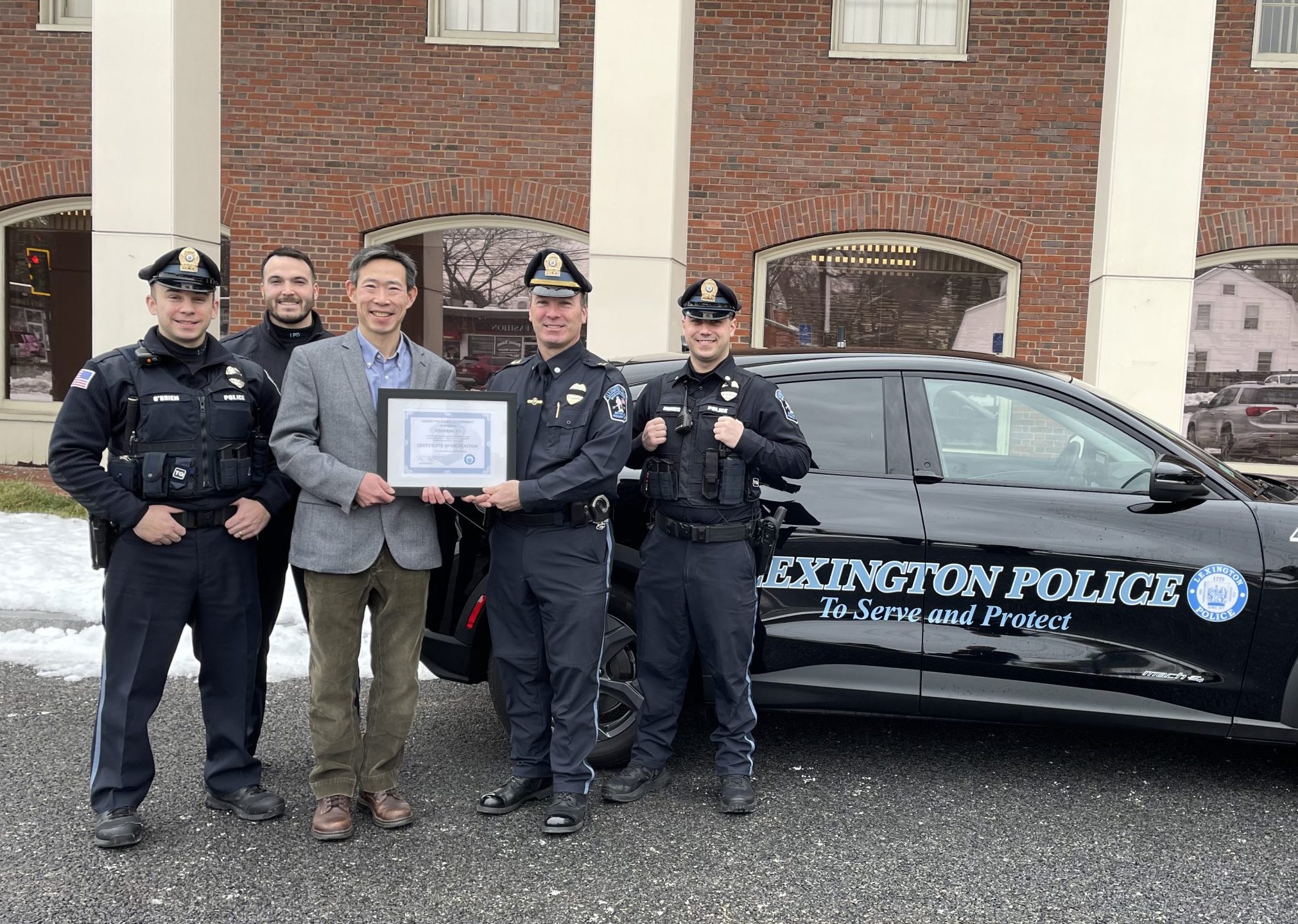 Lexington Police Department awards Haoyang Yu certificate of