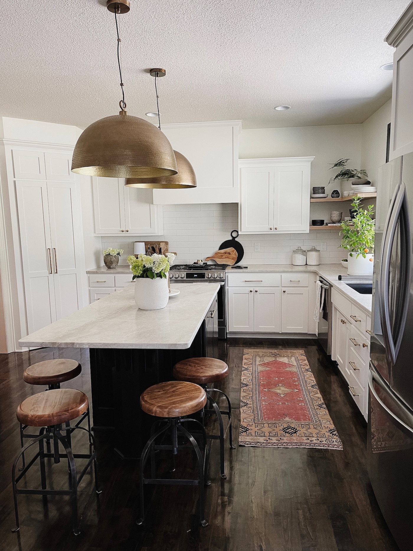 How to Use Oversized Brass Pendant Lights Over the Kitchen Island
